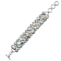 Широкий серебряный браслет с жемчугом и голубыми топазами